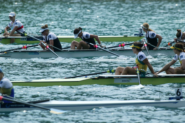 Rower rows toward rowing victory (in a rowboat)