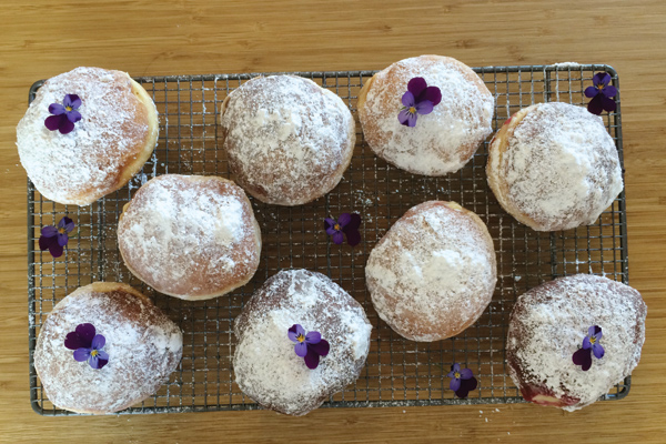 Custard and raspberry cream doughnuts